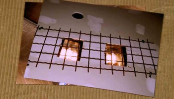halogen lights in ceiling of Robbie\'s cell